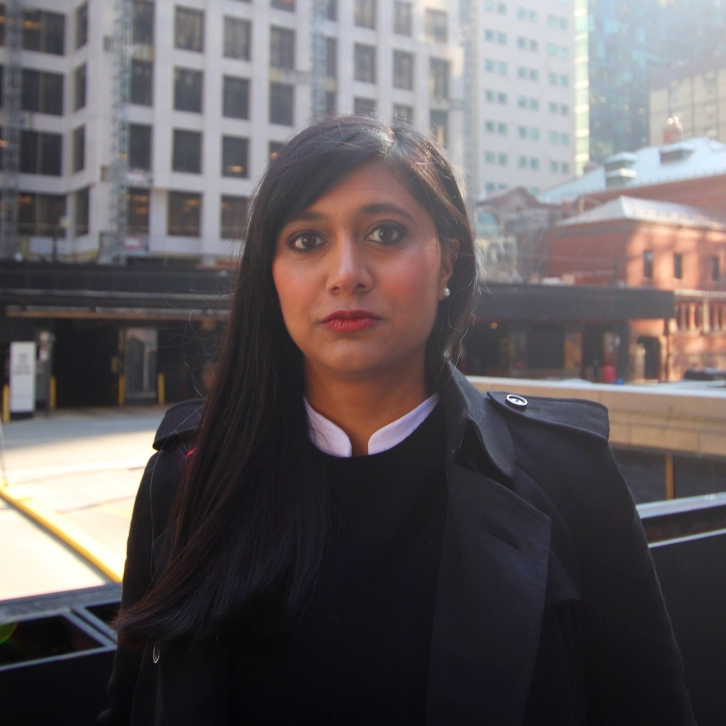 Supriya Dwivedi standing on a city street.